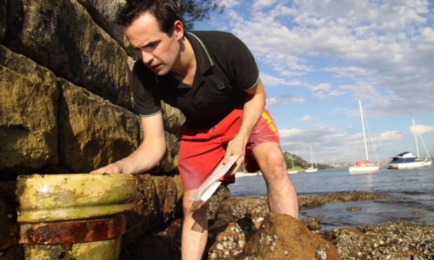 Ecologist Mark Browne takes samples from the shoreline. His pioneering work on microfiber waste has received little support from clothing brands. Photo: Mark Browne 